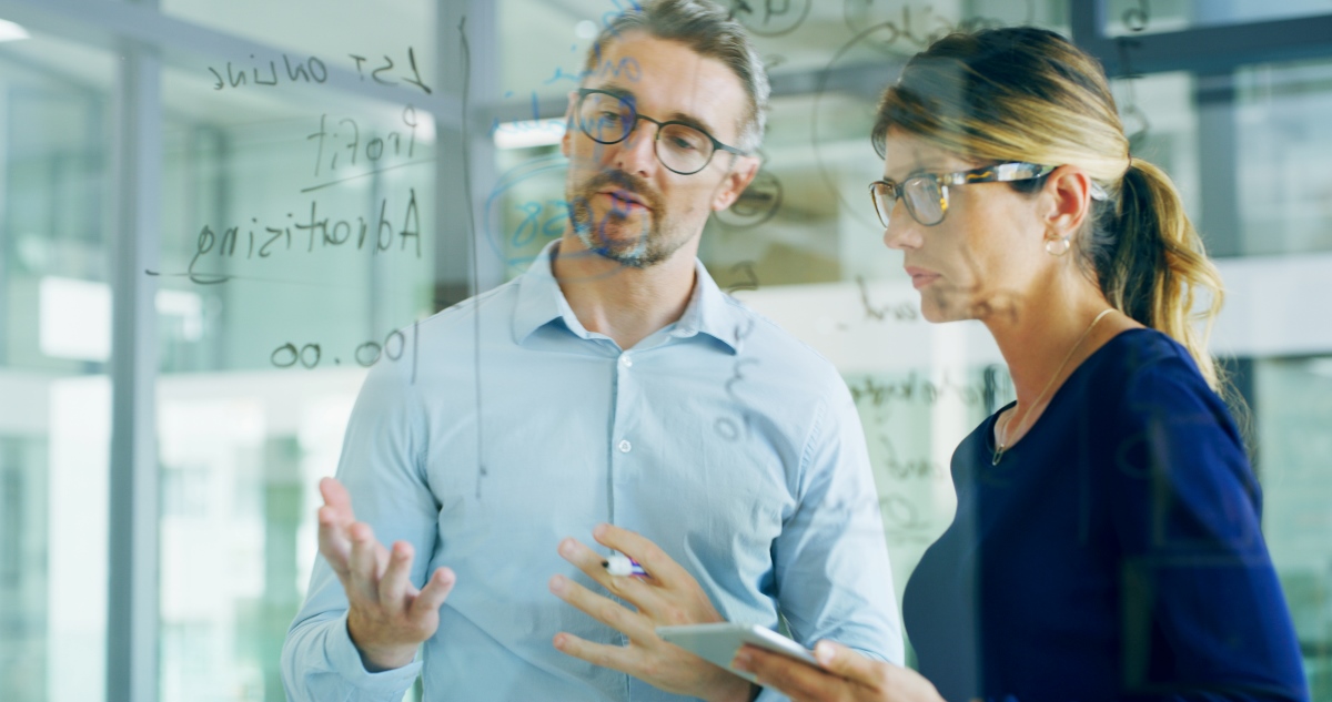 Healthcare professionals collaborating on revenue cycle strategy.